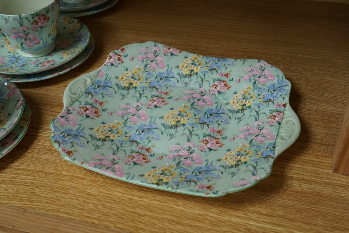 A Shelley ‘Melody’ porcelain six cup tea set, teapot missing, cake plate 25cm square (21)